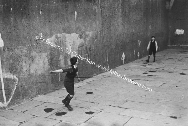 TWO BOYS PLAYING HANDBALL